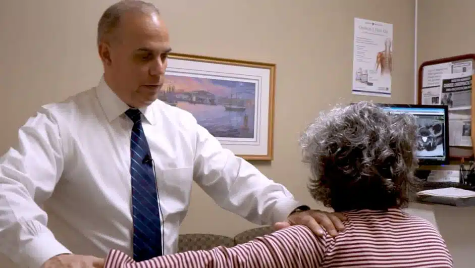 chiropractor with patient